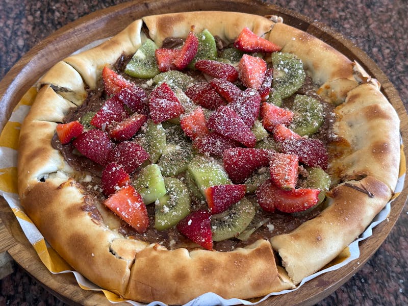 Nutella pizza dessert with berries
