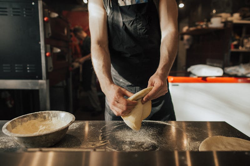 Punch Pizza kitchen — artisan pizza being handcrafted by our team